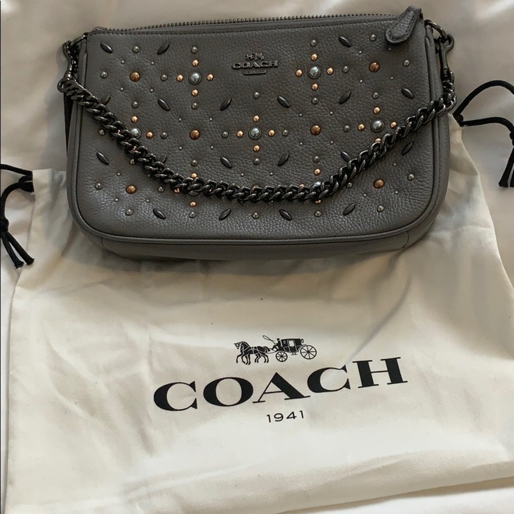 Coach Nolita wristlet with prairie rivets